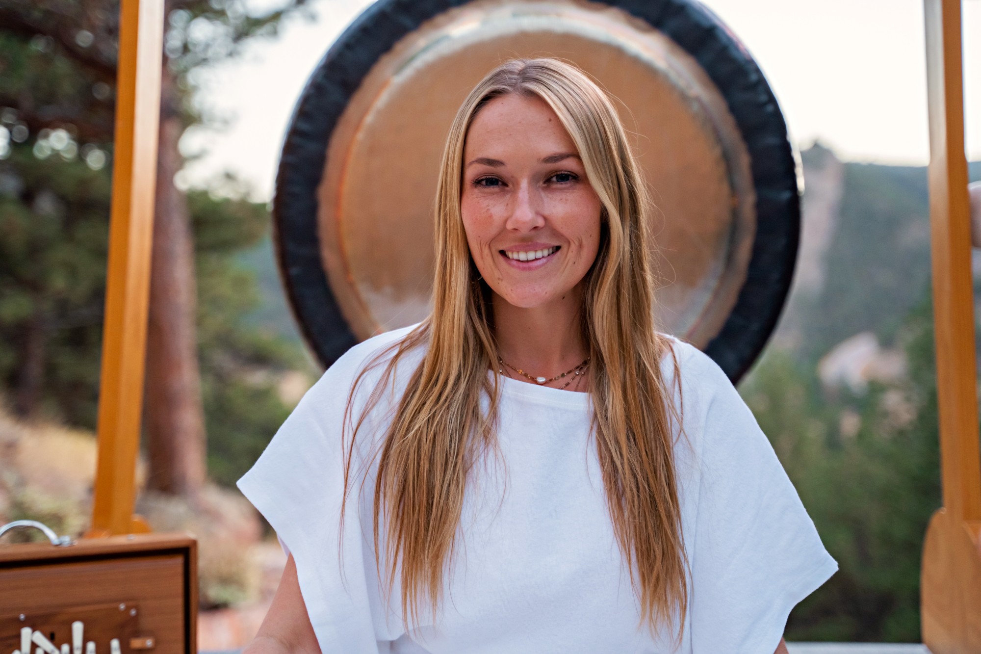 Marley Marina smiling in front of her gong